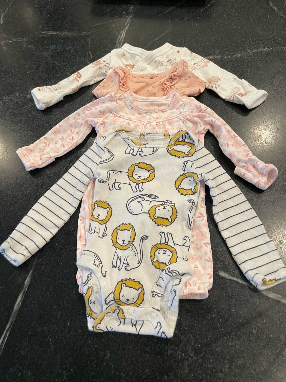 Carter’s Bundle of  4 (four) Preemie / newborn onesies.